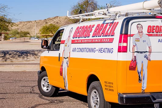 A George Brazil service van parked in the Arizona desert