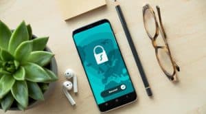 Stock photo of a phone and privacy lock icon.